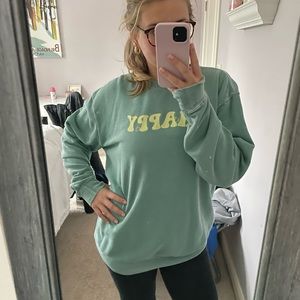 “Happy” green sweater